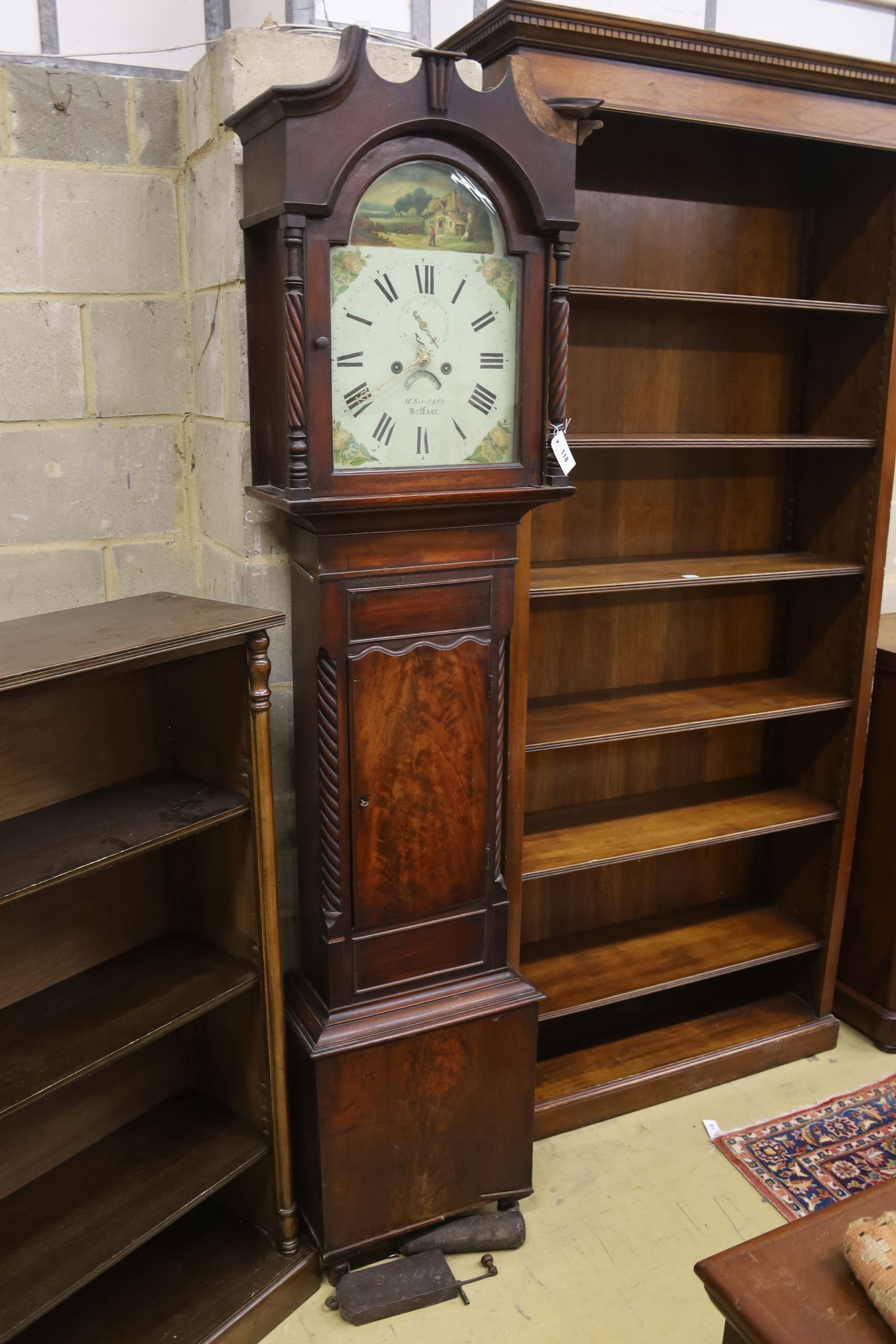 A mid 19th century mahogany eight day longcase clock, the arched painted dial marked M. Sivel & Co., Belfast, height 214cm